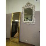 A MODERN CREAM WALL MIRROR 81 X 47 CM AND A GILT RECTANGULAR MIRROR (2)