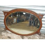 A VINTAGE MAHOGANY FRAMED WALL MIRROR WITH CARVED DETAIL OVERALL SIZE - 85CM X 59CM