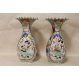 A PAIR OF LARGE ORIENTAL FRILLED TOP CERAMIC VASES, DECORATED WITH SAMURAIS, WITH RESTORATION TO