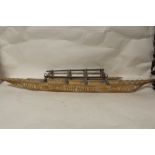 A LARGE POLYNESIAN SAMOAN(?) CARVED MODEL OUT RIGGER CANOE