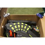 A BOX OF SCALEXTRIC TRACK AND TWO CARS