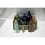 A BOX OF ASSORTED BOTTLES AND STOPPERS TO INCLUDE TWO CODD TYPES