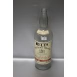 A VINTAGE BELLS OLD SCOTCH WHISKY BOTTLE