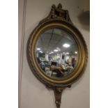 A GILT FRAMED CONVEX WALL MIRROR 40 CM INCLUDING FRAME