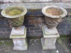 TWO CONCRETE PLANTERS ON PLINTH