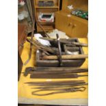 AN ANTIQUE BLACKSMITH TOOL OUTFIT TO INCLUDE A VINTAGE WOODEN TRUGG, FILES, TONGS ETC.