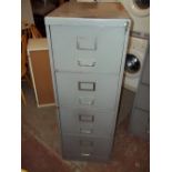 A VINTAGE FOUR DRAWER FILING CABINET WITHOUT KEY