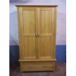 A MODERN OAK DOUBLE WARDROBE WITH LOWER DRAWER, MATCHES LOT 842