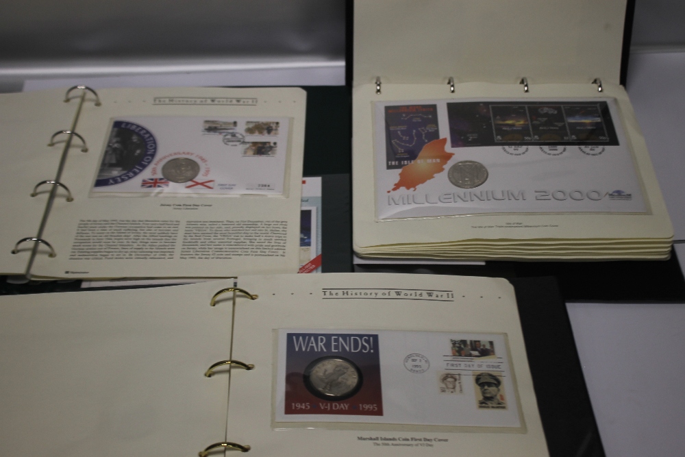 THREE ALBUMS OF VARIOUS STAMP/COIN COVERS, TO INCLUDE AN ALBUM OF MILLENNIUM INTEREST AND AN ALBUM