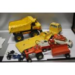 FOUR TONKA TOYS INCLUDING AIR FRANCE RESCUE TRUCK, RACING CAR, MIGHTY DUMP TRUCK ETC. TOGETHER