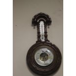 A SMALL HANGING BAROMETER