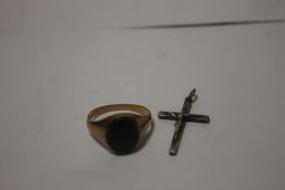 A 9 CT GOLD SIGNET RING SET WITH A GREEN BLOOD STONE ALONG WITH A SMALL SILVER CRUCIFIX