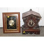 A CARVED BLACK FOREST STYLE CUCKOO MANTEL / WALL CLOCK TOGETHER WITH A MODERN WALL CLOCK IN THE FORM