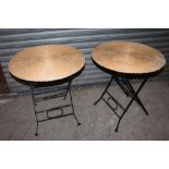 A PAIR OF WICKER TOPPED FOLD-OUT TABLES