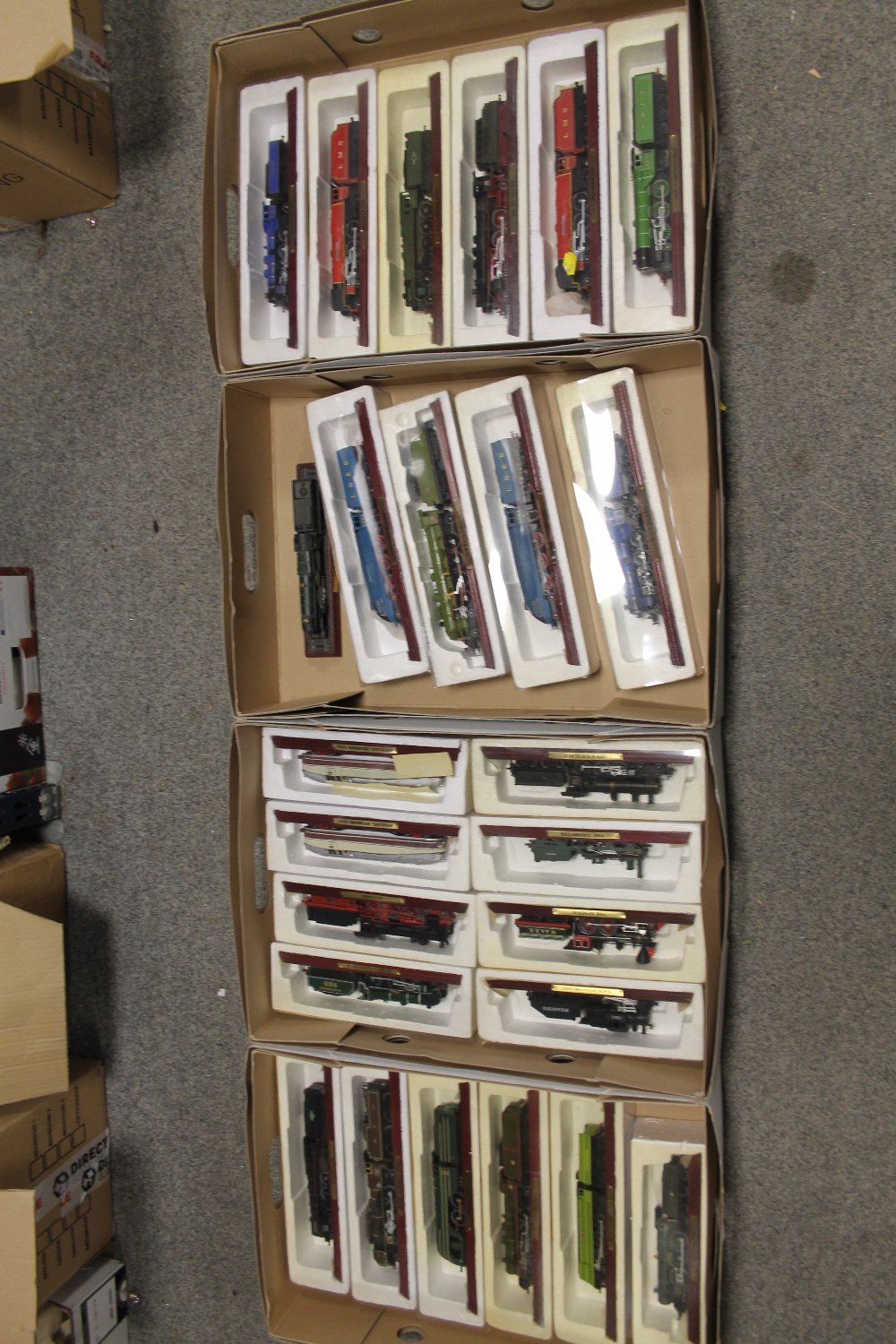 FOUR TRAYS OF CASED COLLECTABLE TRAIN MODELS