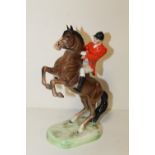 A BESWICK REARING HORSE AND RIDER NO 868 S/D