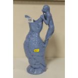 AN UNUSUAL BLUE CERAMIC JUG IN THE FORM OF A MONKEY PEERING INTO A LARGE BIRDS BEAK HEIGHT- 33CM