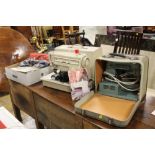 A SINGER 507 SEWING MACHINE AND ANOTHER PLUS A BOX O F SEWING & KNITTING ACCESSORIES