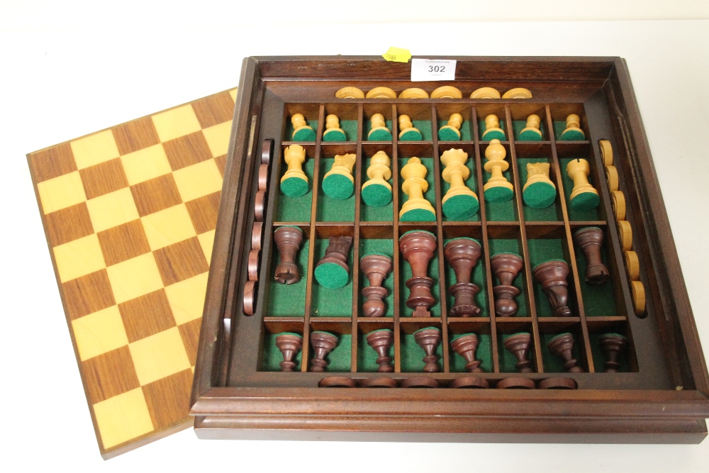 A CARVED WOODEN CHESS SET