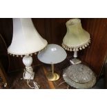 A VINTAGE BRASS CEILING LIGHT SHADE TOGETHER WITH TWO ALABASTER TABLE LAMPS AND A MODERN EXAMPLE (