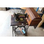 A SINGER TREADLE SEWING MACHINE TABLE & ACCESSORIES