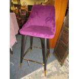 A MODERN PURPLE UPHOLSTERED STOOL