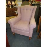 A MODERN UPHOLSTERED WINGBACK ARMCHAIR TOGETHER WITH ANOTHER CHAIR
