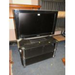 A PANASONIC FLATSCREEN 31" TV AND STAND - HOUSE CLEARANCE