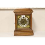 A BRASS FACED MANTEL CLOCK