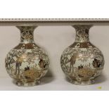 A PAIR OF LARGE ORIENTAL CERAMIC VASES DECORATED WITH BIRDS ON BRANCHES WITH ORANGE CHARACTER