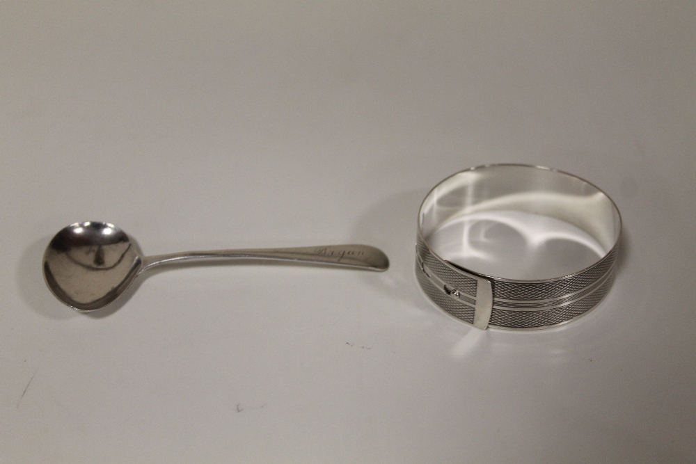 A HALLMARKED SILVER BABY FEEDING SPOON, TOGETHER WITH A HALLMARKED SILVER BANGLE (2) COMBINED WEIGHT