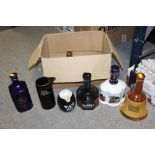 A BOX OF CERAMIC WHISKEY DECANTERS AND JUGS TO INCLUDE WADE EXAMPLES