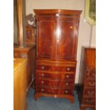 A REPRODUCTION MAHOGANY DRINKS CABINET ON CHEST - SERPENTINE FRONTED H-152 CM W-69 CM