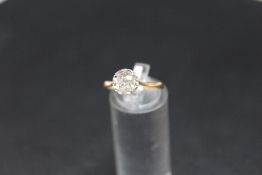 AN 18CT GOLD DIAMOND SOLITAIRE RING, the old cut diamond being of and estimated 0.75 carat, in an