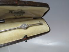 A DIAMOND SET UNMARKED WHITE METAL BAR BROOCH, L 6 cm, approx weight 4.3 g