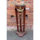 AN ANTIQUE EMPIRE STYLE MARBLE TOPPED JARDINIERE STAND, having gilt metal mounts, tapered supports