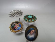 A SELECTION OF FOUR LARGE VINTAGE COSTUME BROOCHES, to include an oval ceramic panel set within a