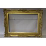 A 20TH CENTURY GOLD SWEPT FRAME WITH GILT SLIP, frame W 8 cm, rebate 57 x 76 cm