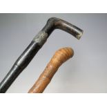 A VINTAGE ORIENTAL CARVED WALKING CANE WITH ROOT BALL KNOP, the shaft having typical carved