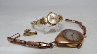 A LADIES 9 K GOLD CASED WRISTWATCH, on 9 ct gold expanding strap, A/F, together with an 18 K gold