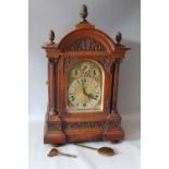 A LARGE CARVED OAK CASED BRACKET CLOCK BY WINTERHOLDER AND HOFMEIER, with a Westminster /