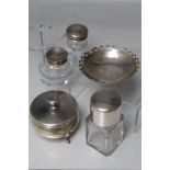 A COLLECTION OF HALLMARKED SILVER VARIETY ITEMS, comprising three silver topped jars and a