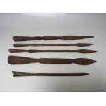 FIVE VARIOUS EARLY ETHNIC SPEAR ENDS, longest 30 cm, shortest 17 cm