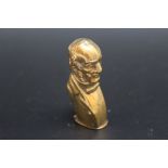 A NOVELTY BRASS VESTA IN THE FORM OF WILLIAM GLADSTONE. H 5.5 cm