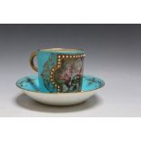 SERVES - A HAND PAINTED JEWELLED CUP AND SAUCER OF CHILDREN HUNTING WATERBIRDS, marks to base, H 7