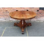 A 19TH CENTURY ROSEWOOD TILT TOP TABLE. the circular top with original mechanism, supported on a