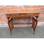 A VICTORIAN MAHOGANY FOLDING CAMPAIGN TRAVELLING DESK, having two frieze drawers, the lyre shaped