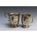 TWO HALLMARKED SILVER SMALL TANKARDS, the larger being a Chester 1911 example, both with