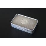 A HALLMARKED SILVER SNUFF BOX - CHESTER 1912, makers mark C.C., with raised border, and engine