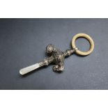 A HALLMARKED SILVER BABY'S BELL RATTLE TEETHER - BIRMINGHAM 1915, with mother of pearl handle, ivory
